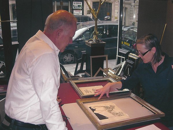 John Choosing frames with Caroline de Courbeville at the shop in Paris.jpg